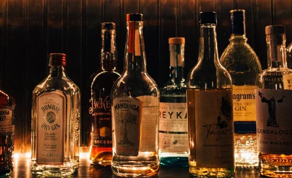 Various bottles of alcohol on a bar