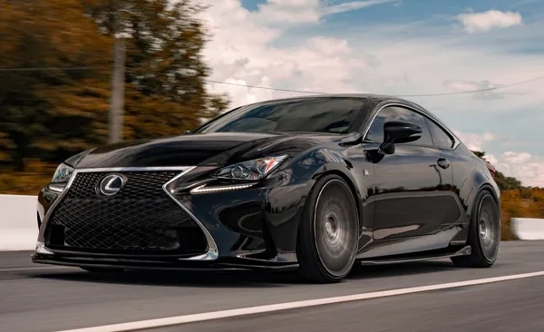 A Lexus sedan driving on the street