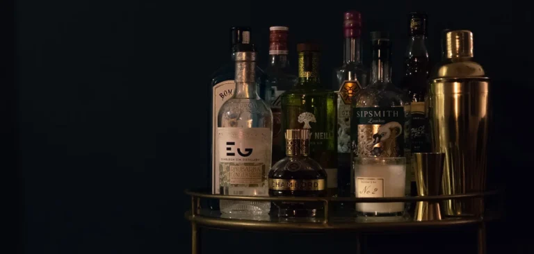 Several bottles of alcohol on a bar