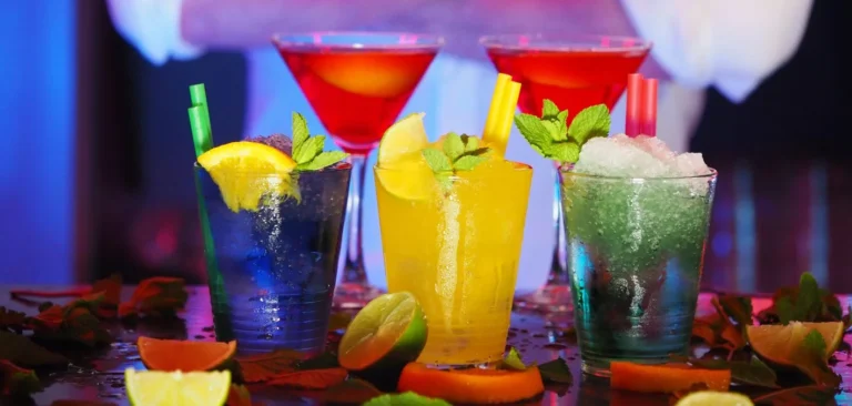 Colorful arrangement of three alcoholic drinks on a bar