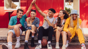 Group of Gen Z sitting together and laughing