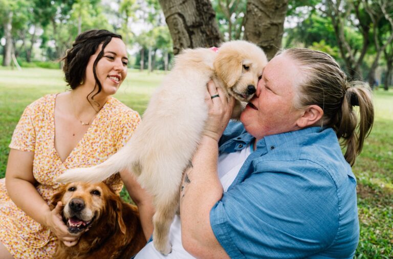 LGBTQ+ women with dog in the park